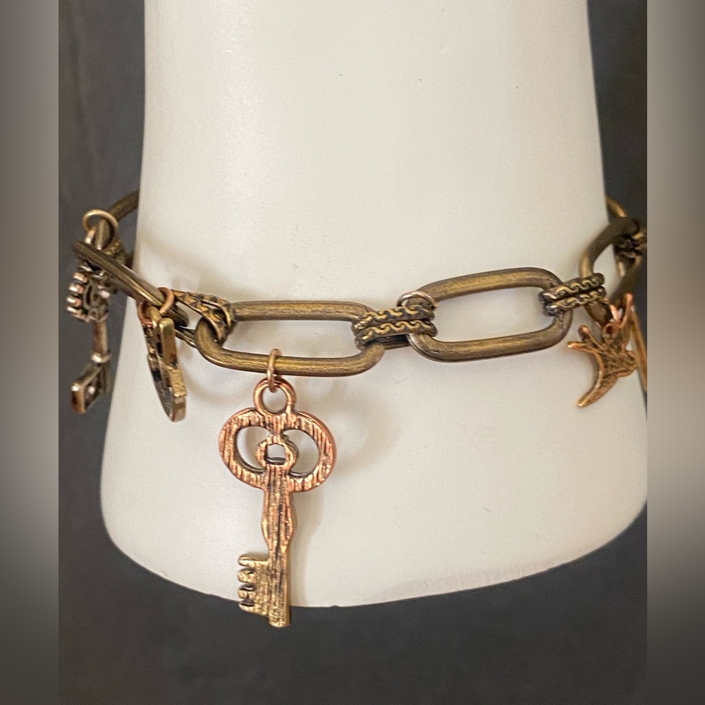 Bird lock key Charm bracelet bronze gold tone